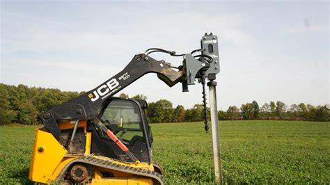 post pounder for skid steer|post pounder attachment for bobcat.